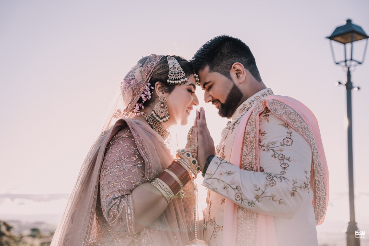 Wedding couple sharing a quiet moment together outdoors