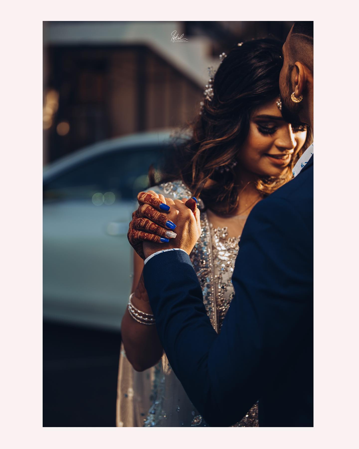 Close-up of a couple embracing with their hands clasped